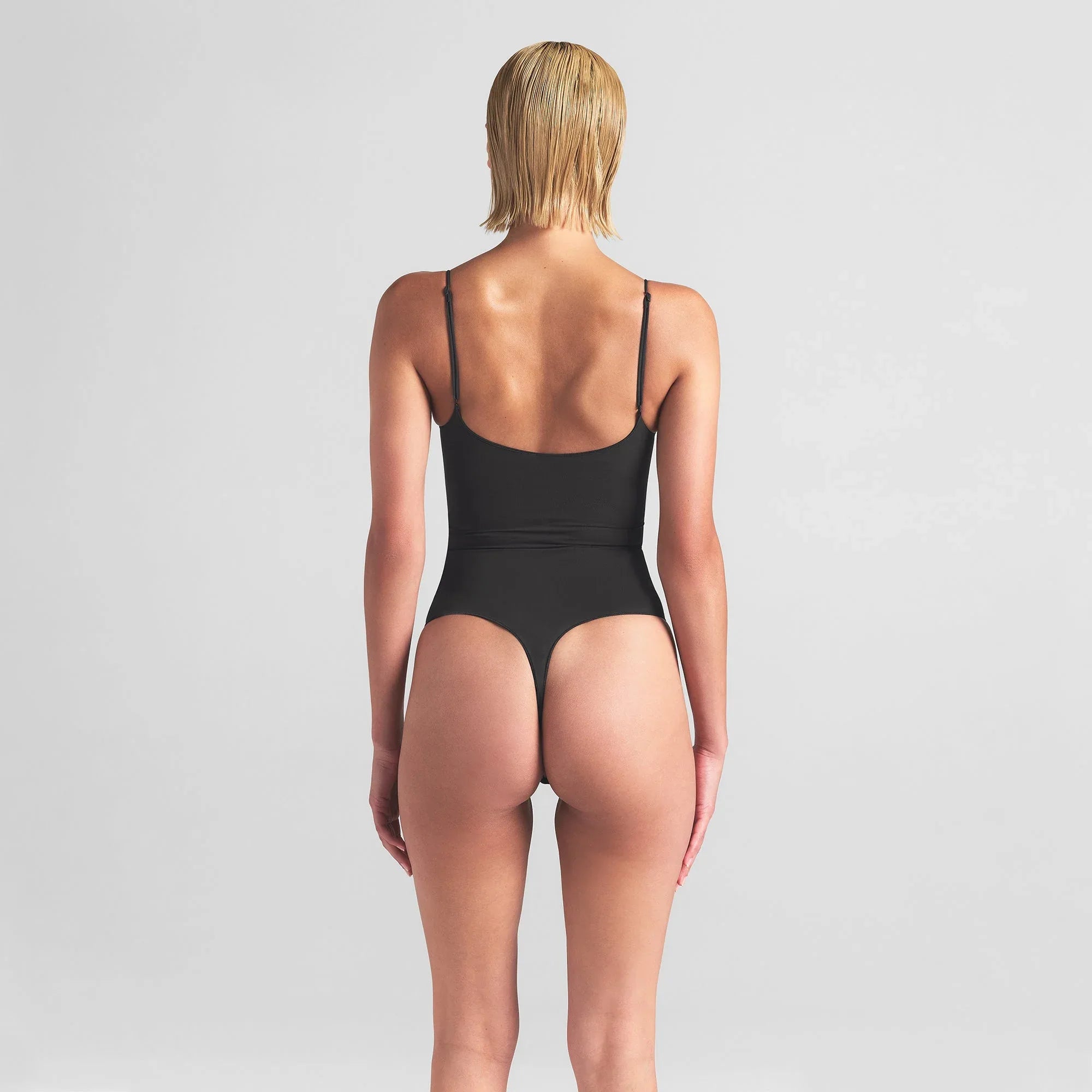 SKIMS SHEER SEAMLESS THONG BODYSUIT | ONYX - BODYSUIT - My Suti