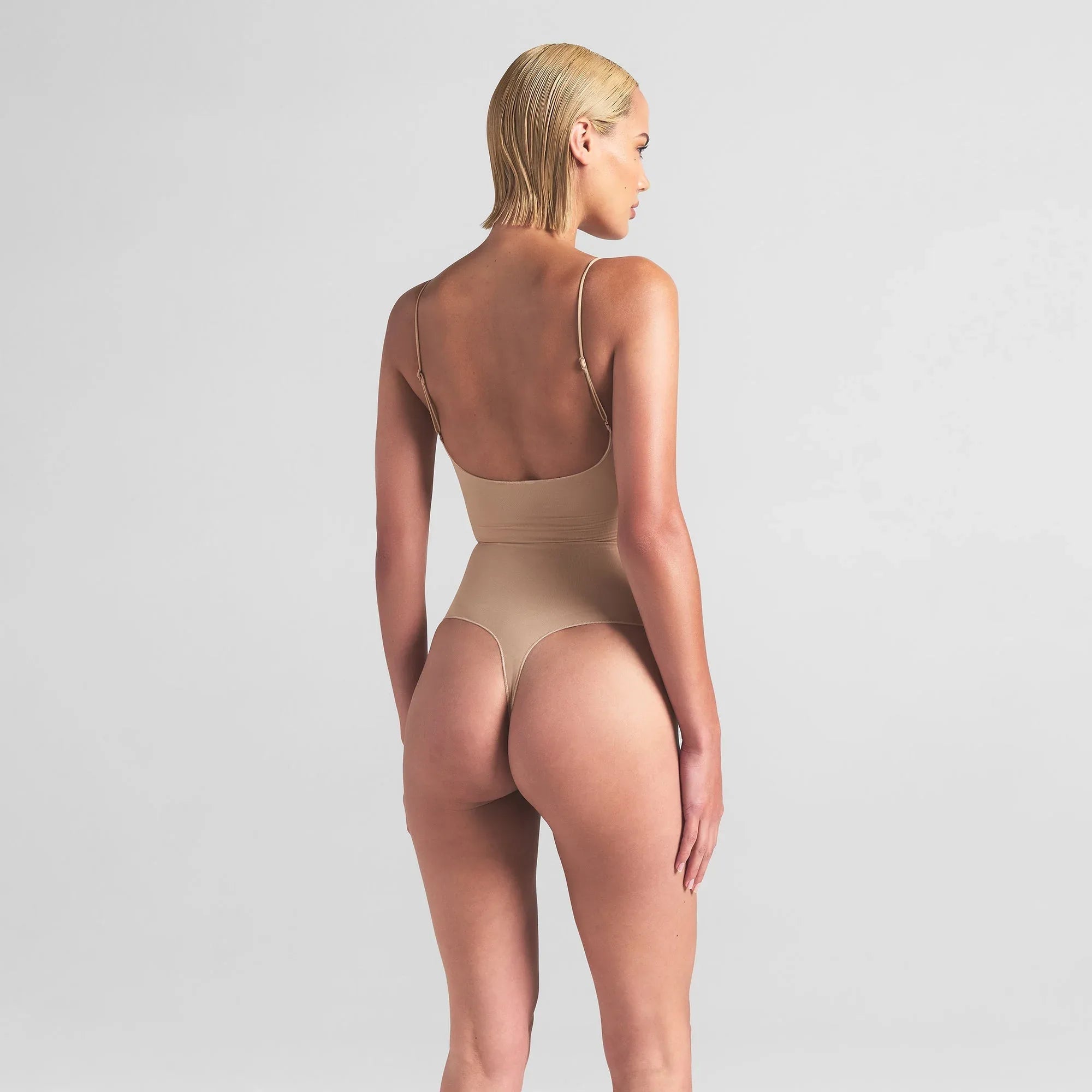 SKIMS SHEER SEAMLESS THONG BODYSUIT | SAND - BODYSUIT - My Suti