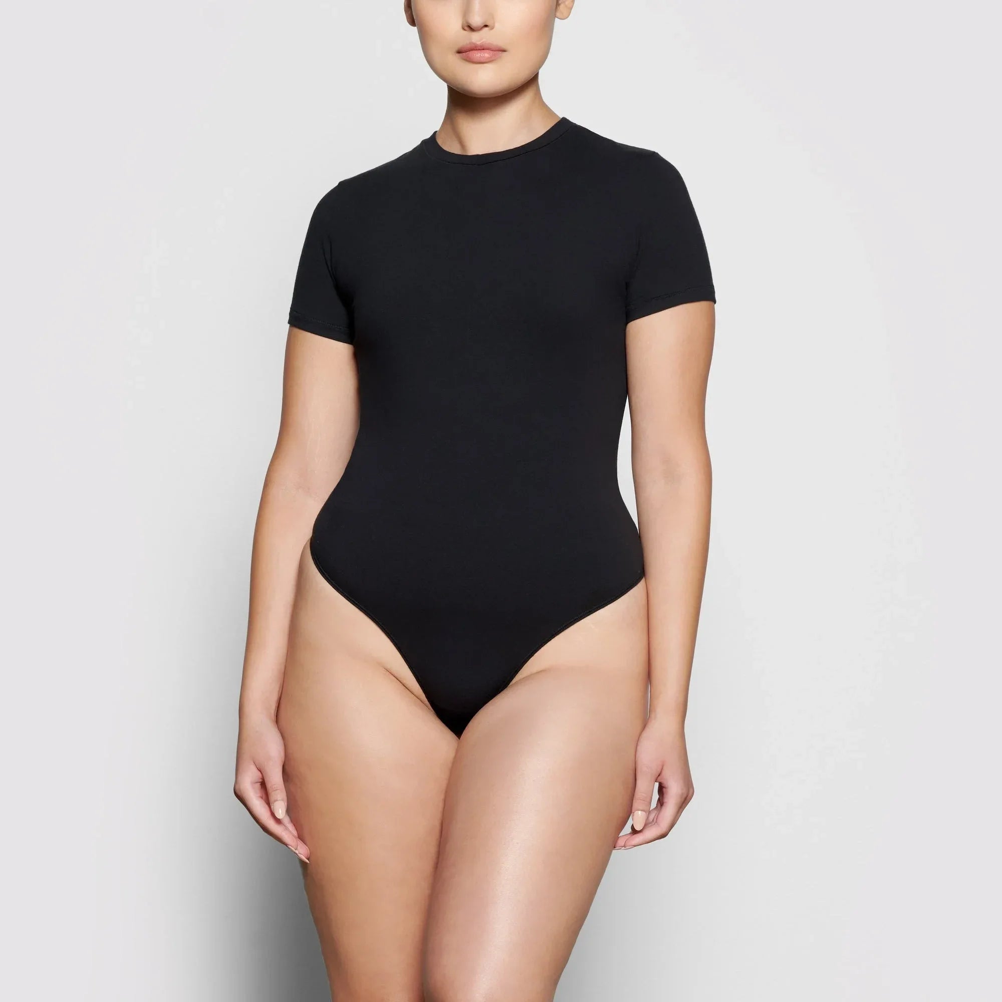 SKIMS COTTON JERSEY T-SHIRT BODYSUIT | SOOT - BODYSUIT - My Suti
